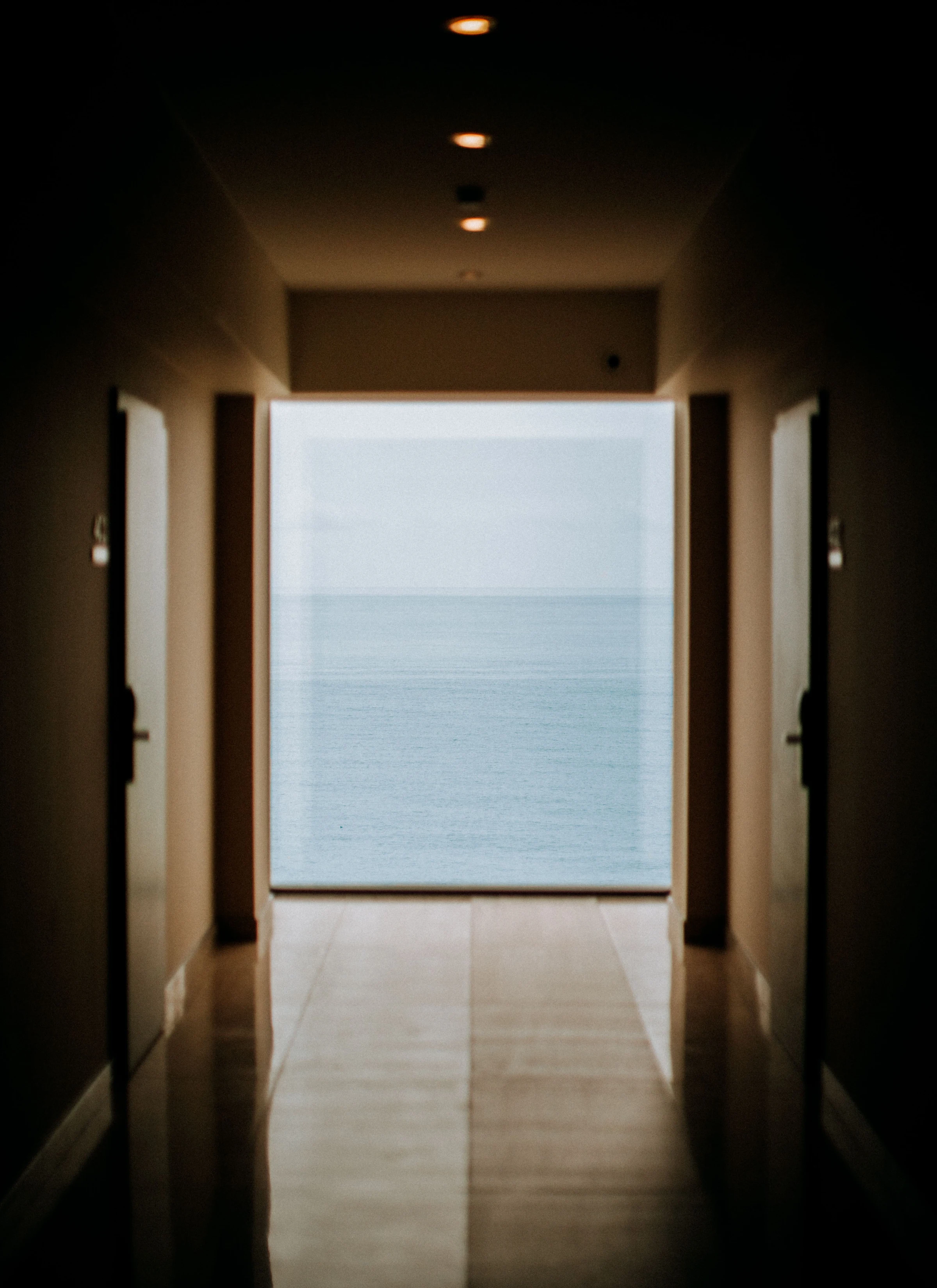 A quiet passage opening onto the sea and horizon.